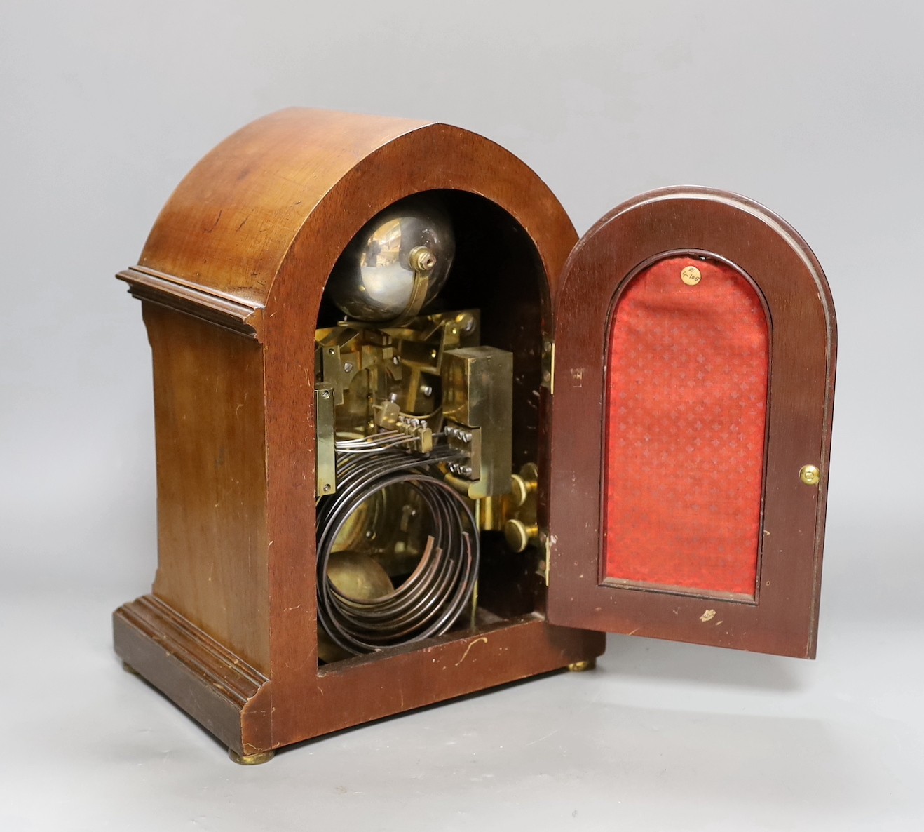 A George V inlaid walnut lancet shaped chiming mantel clock, with German movement and 15th July 1914 presentation plaque. 29cm high